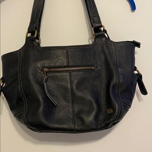 The Sak Black Leather Handbag with Gold Accents, has pen marks see picture